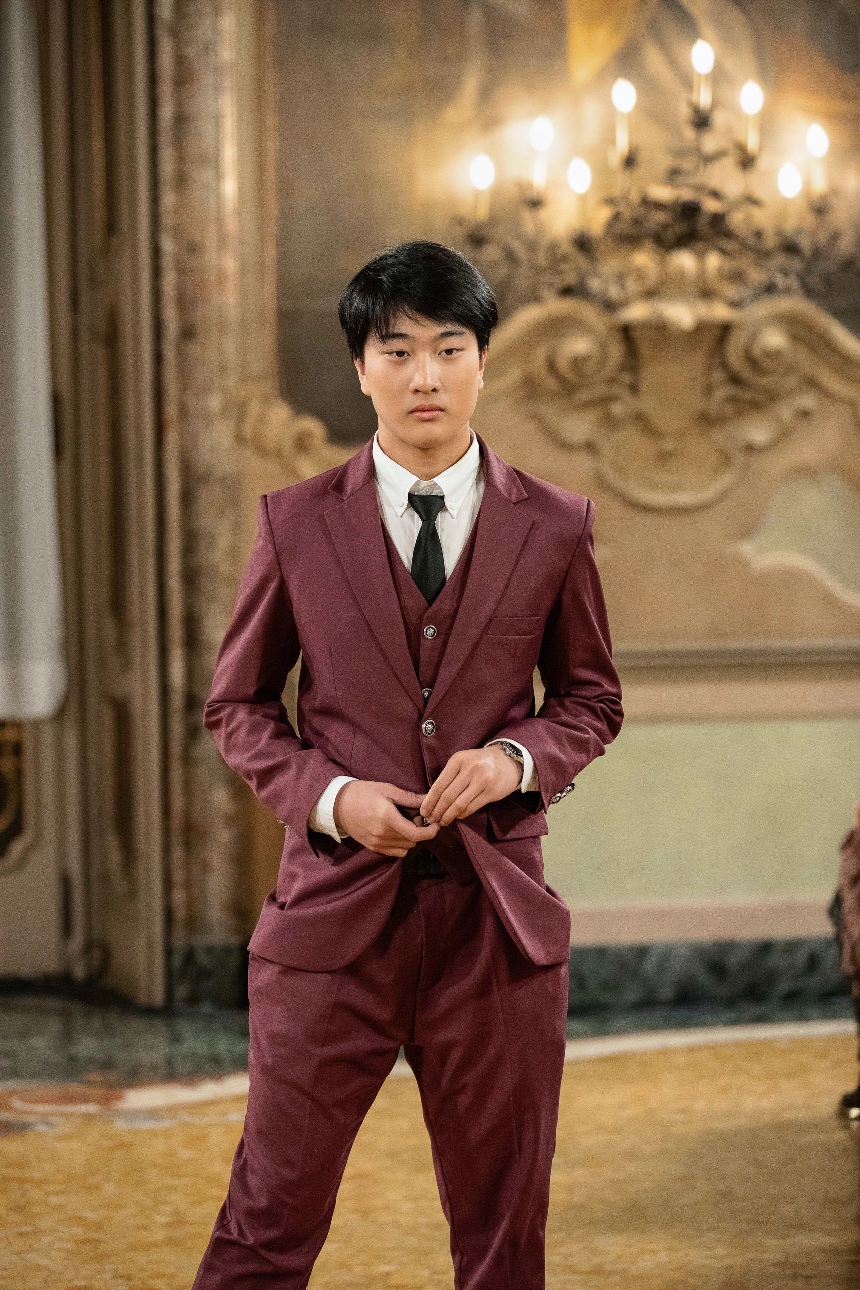 Daniel in a burgundy Mila Hoffman Couture suit in Milan